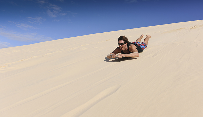 sand-tobogganing-tangalooma-queensland-australia