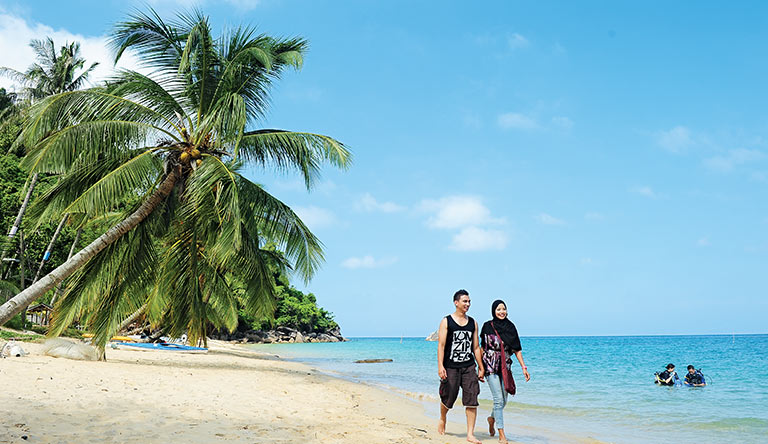 couple-on-beach-penang-malaysia